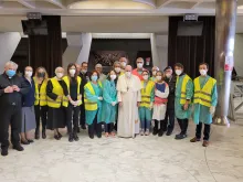 Pope Francis with the volunteers helping vaccinate people in need at the Vatican April 2, 2021.